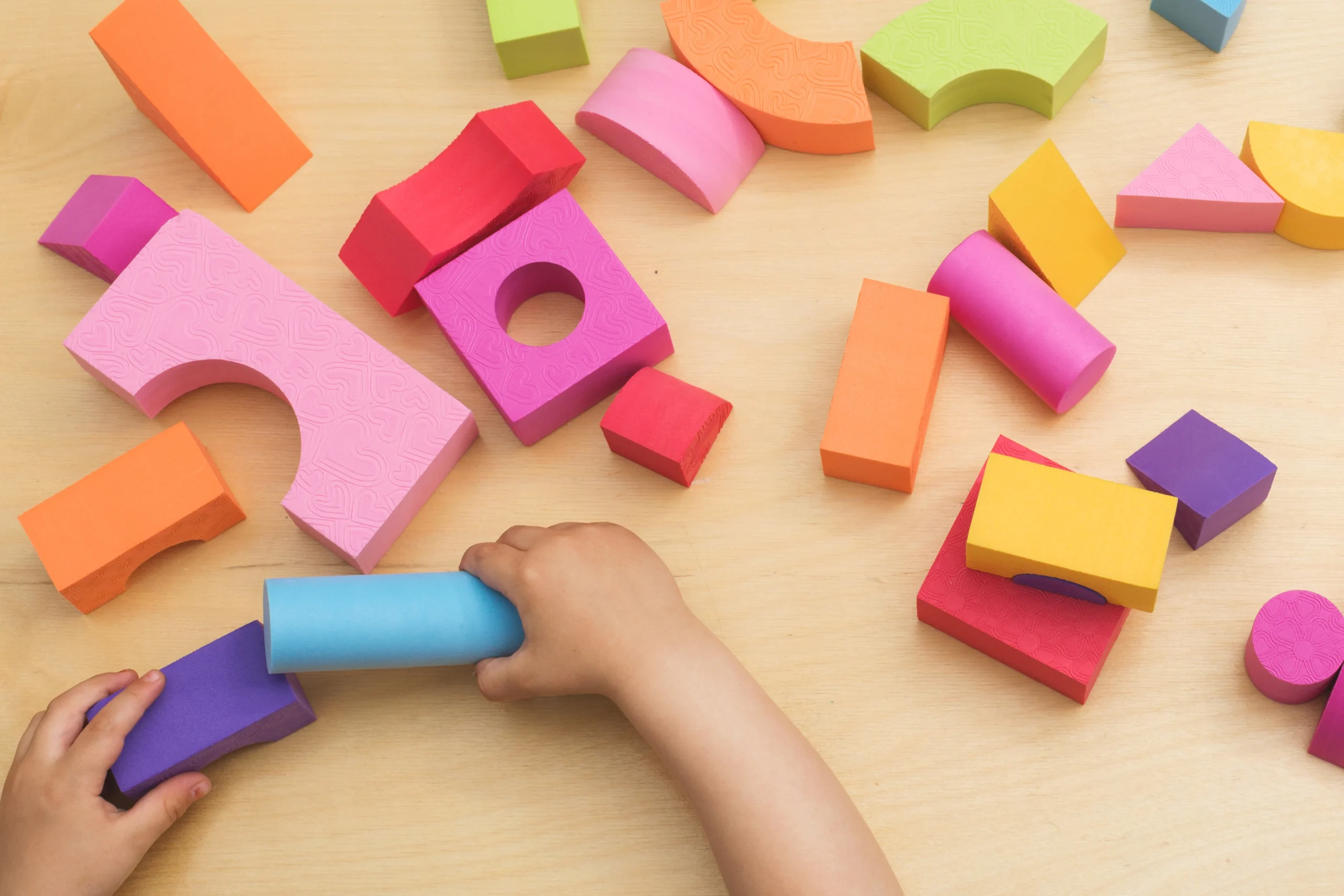 kid playing with block toys from Megajoy